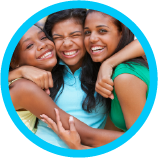 A group of young woman hugging each other